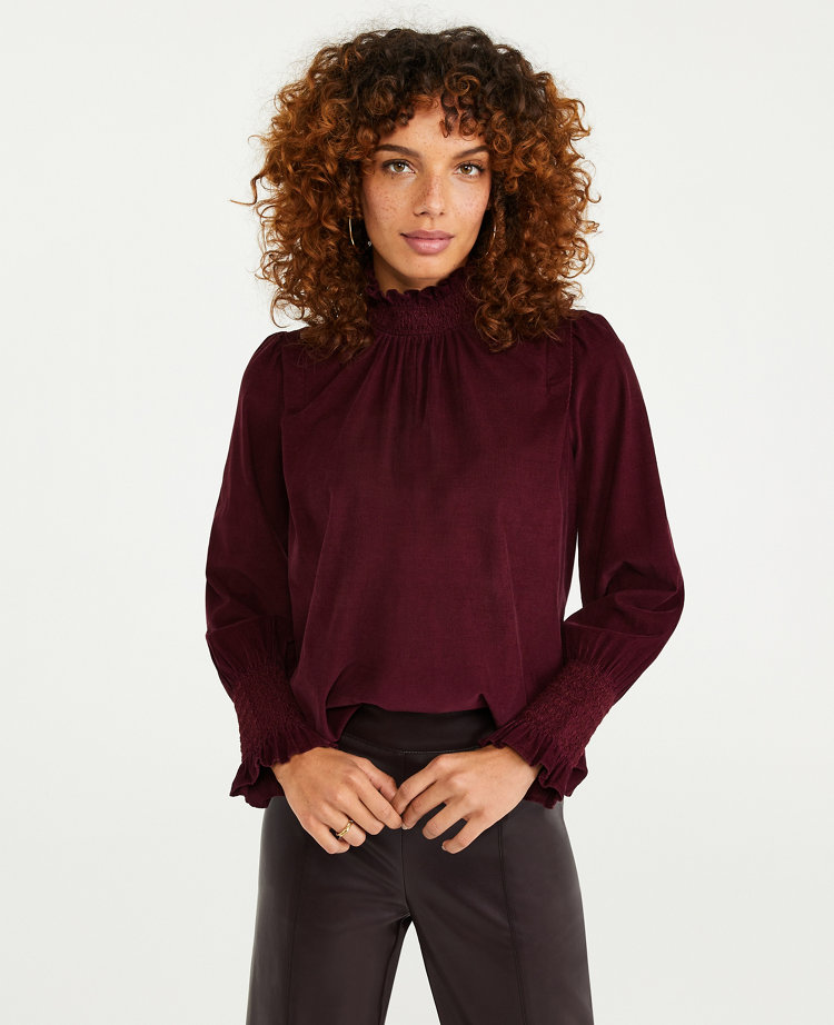 smocked mock neck blouse