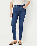 Petite Sculpting Pocket Mid Rise Skinny Jeans in Mid Stone Wash carousel Product Image 1