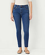 Petite Curvy Sculpting Pocket Mid Rise Skinny Jeans in Mid Stone Wash carousel Product Image 1