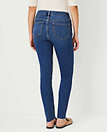 Petite Curvy Sculpting Pocket Mid Rise Skinny Jeans in Mid Stone Wash carousel Product Image 2