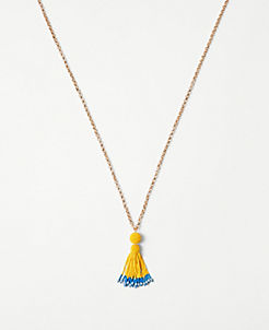 Long silver necklace with blue and mustard yellow beaded drop & tassel