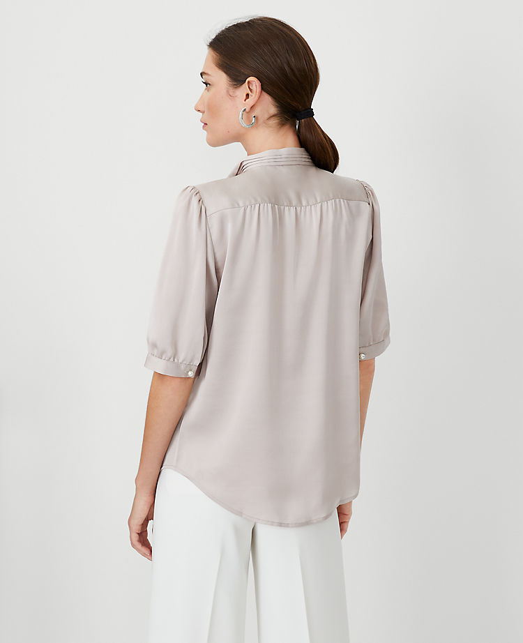 Pearlized Button Pleated Mock Neck Top