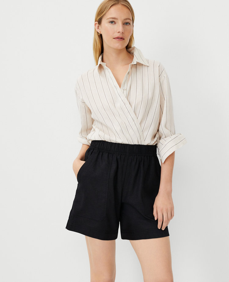 Shop Ann Taylor Petite Weekend Collection Patch Pocket Easy Mid Shorts In Black