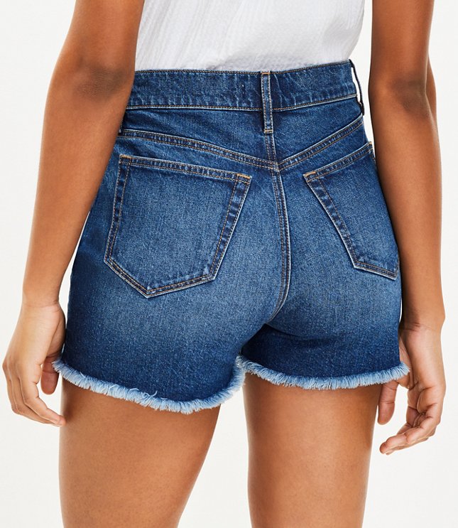 High Rise Frayed Cut Off Denim Shorts in Staple Mid Indigo Wash
