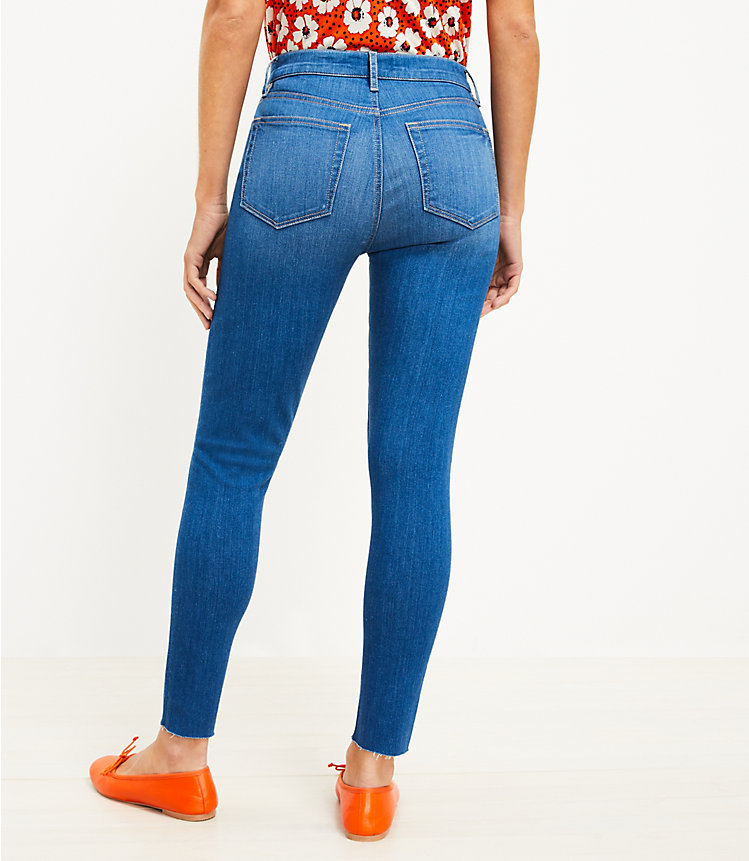 Curvy Chewed Hem Mid Rise Skinny Jeans in Bright Mid Vintage Wash image number null