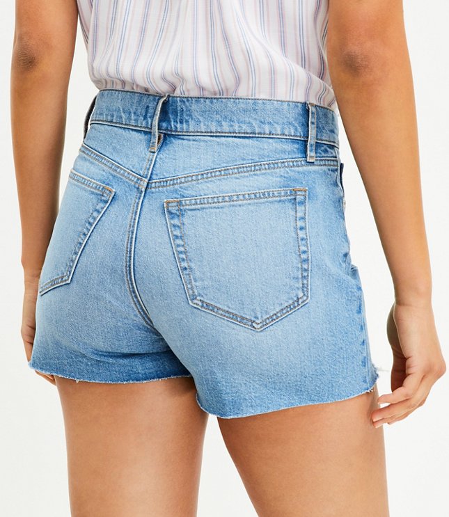 Petite Button Front High Rise Destructed Cut Off Denim Shorts in Mid Indigo Wash