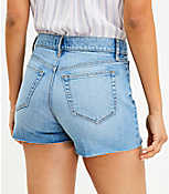 Petite Button Front High Rise Destructed Cut Off Denim Shorts in Mid Indigo Wash carousel Product Image 3
