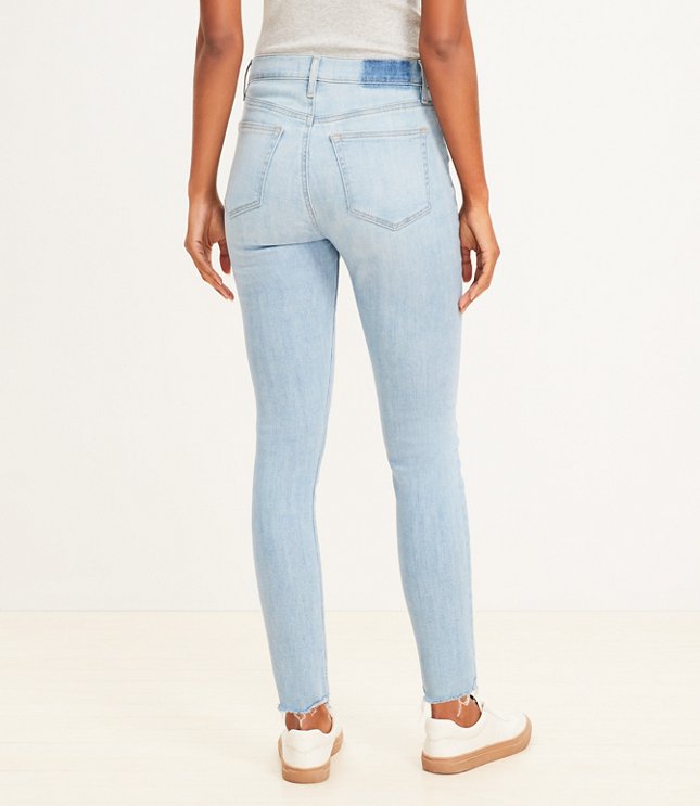 Destructed Button Front High Rise Skinny Jeans in Light Wash