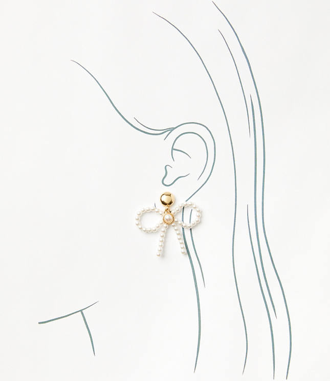 Pearlized Bow Statement Earrings