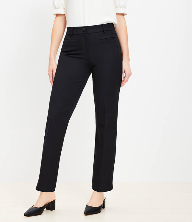 A woman wearing black pants