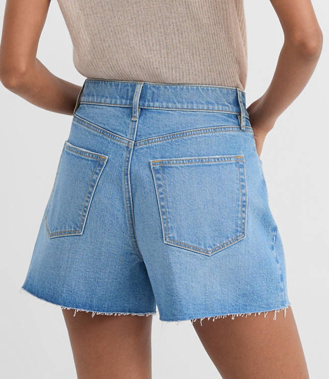 Rivete High Rise Cut Off Denim Shorts in Mid Wash