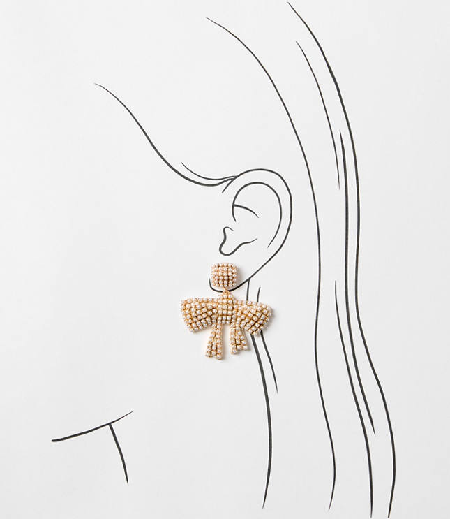 Pearlized Bow Statement Earrings